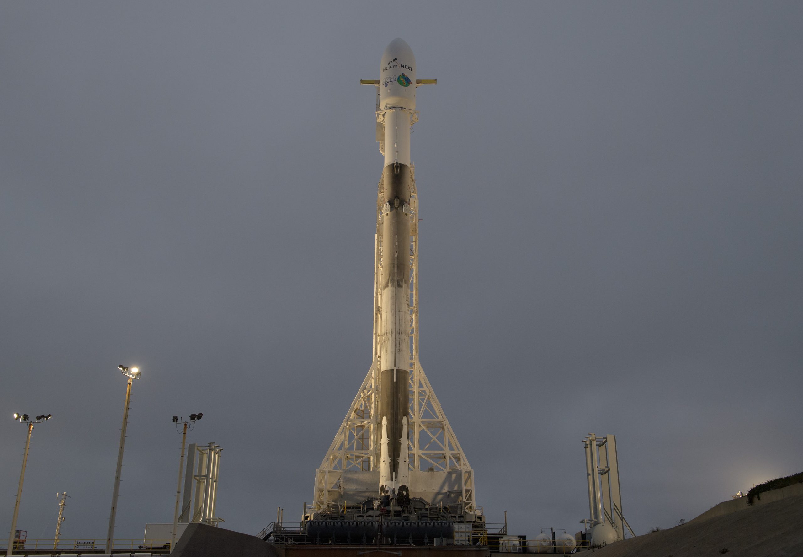 The SpaceX Falcon 9 rocket is seen with the NASA/German Research Centre for Geosciences GRACE Follow-On spacecraft onboard, Monday, May 21, 2018, at Space Launch Complex 4E at Vandenberg Air Force Base in California. The mission will measure changes in how mass is redistributed within and among Earth's atmosphere, oceans, land and ice sheets, as well as within Earth itself. GRACE-FO is sharing its ride to orbit with five Iridium NEXT communications satellites as part of a commercial rideshare agreement by NASA/Bill Ingalls
